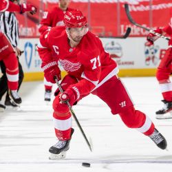 Dylan Larkin skating with the puck